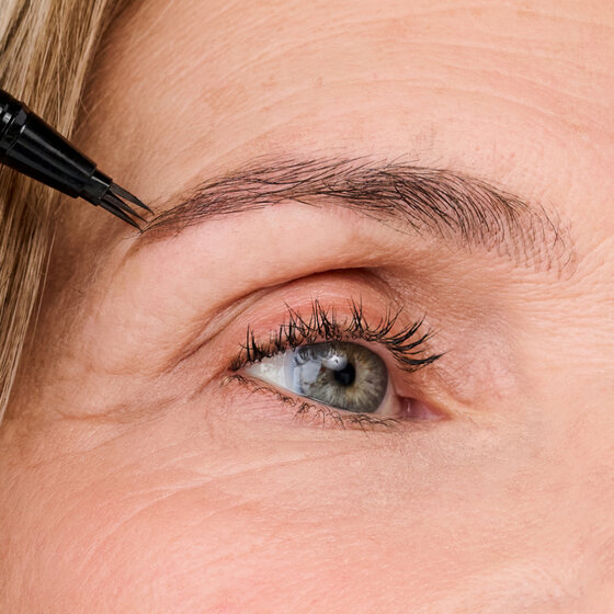 Model applying Might Fine Brow Pen