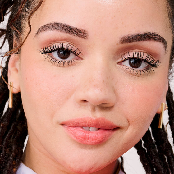 Model wearing BADgal Bounce mascara