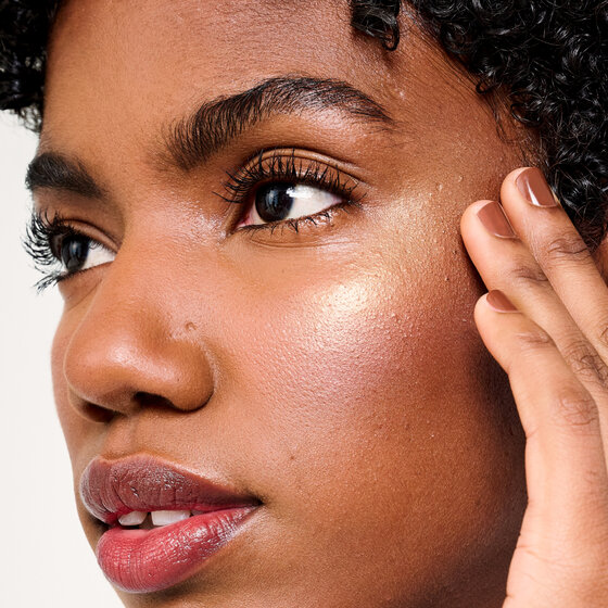 Glow La La model applying product